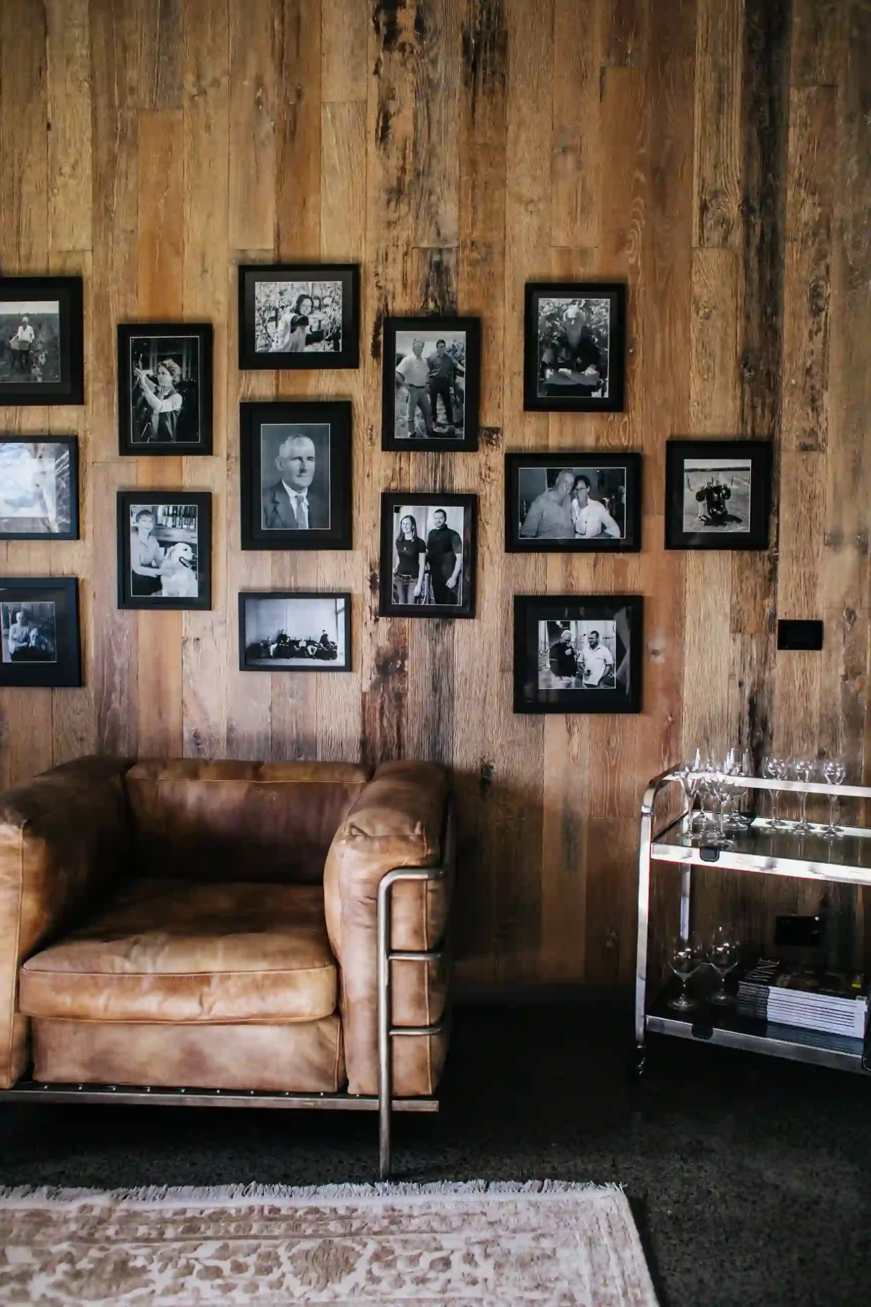 A wall of DIY photo tiles in a living room.